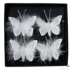 Kép 1/3 - Dekor pillangó 24' csiptetős, organza anyag, fehér 5cm 4db/doboz sdkae